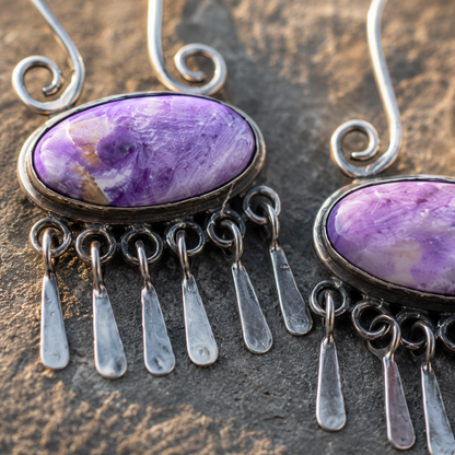 Handcrafted women's earrings featuring purple agate inlay and tassels.