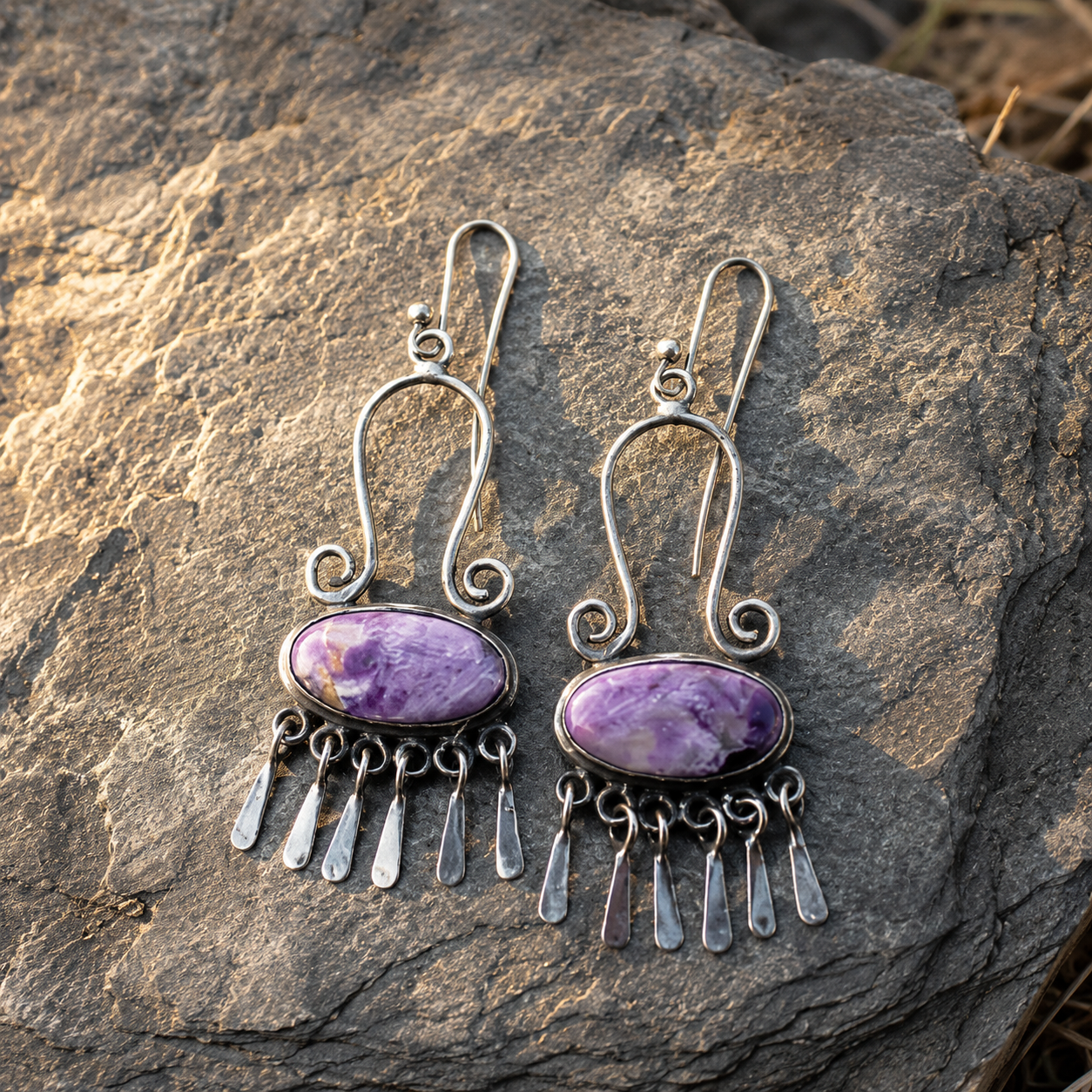 Handcrafted women's earrings featuring purple agate inlay and tassels.